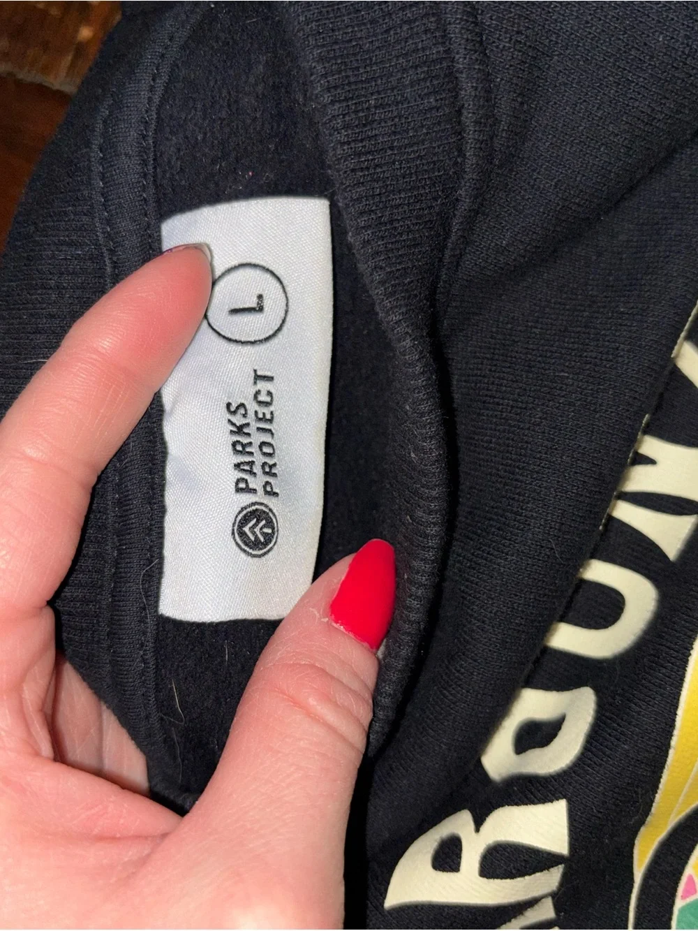 Parks Project Black Sweatshirt with Yellow Smiley & Multicolor Accents